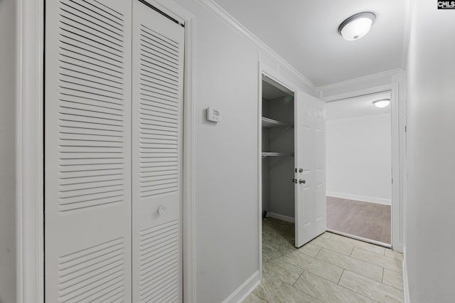 hallway featuring ornamental molding