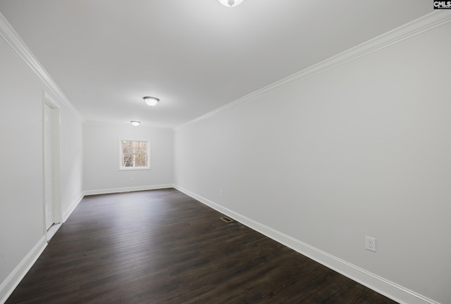 unfurnished room with crown molding and dark hardwood / wood-style flooring