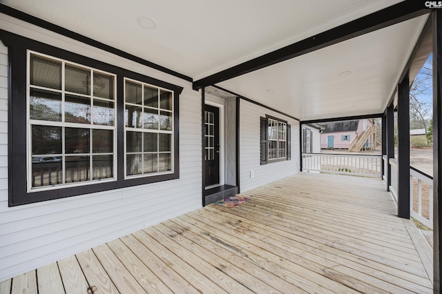 wooden deck featuring covered porch