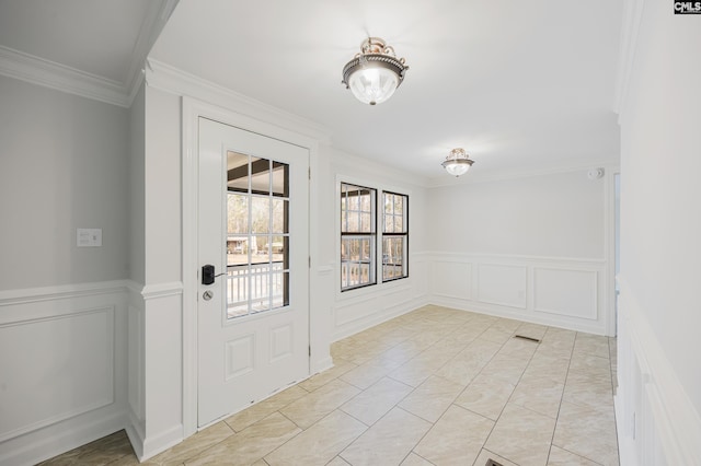 doorway to outside featuring ornamental molding