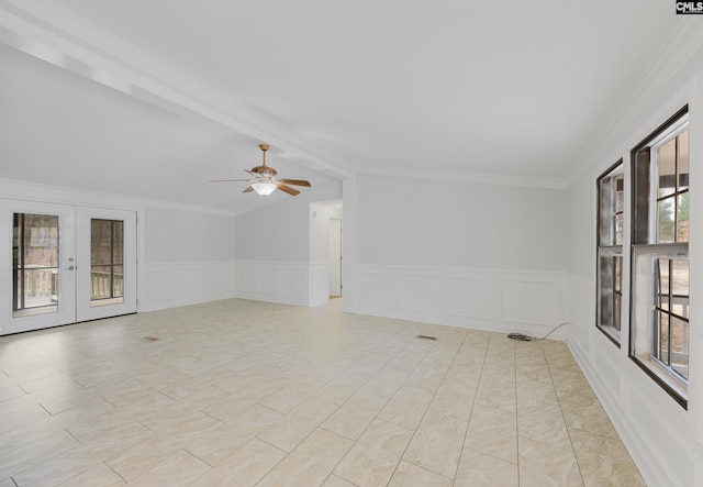 spare room featuring crown molding, french doors, and ceiling fan