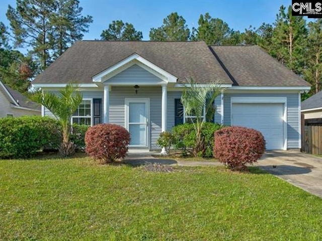 view of front facade with a garage and a front lawn