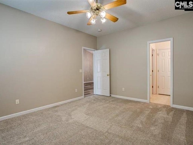 unfurnished bedroom featuring light colored carpet and ceiling fan