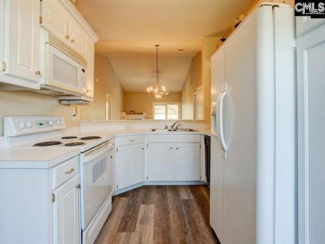 kitchen with white appliances, hanging light fixtures, sink, and white cabinets