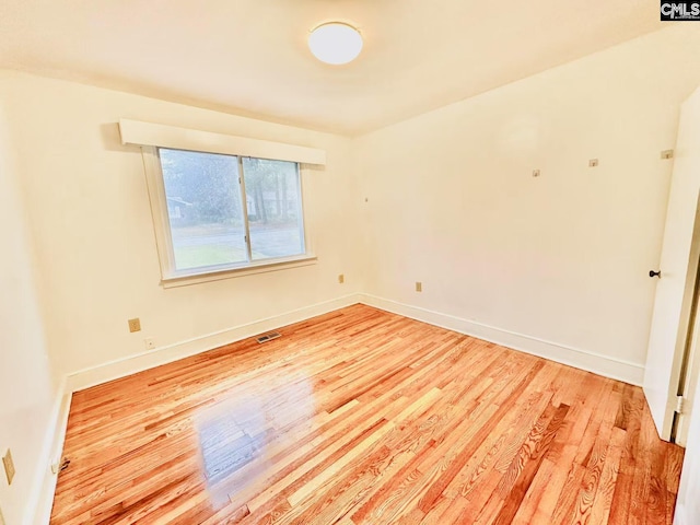 unfurnished room featuring light wood-type flooring