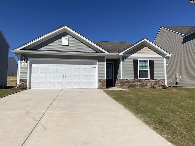 view of front of property with a garage and a front yard