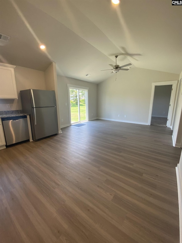 unfurnished living room featuring lofted ceiling, dark hardwood / wood-style flooring, and ceiling fan