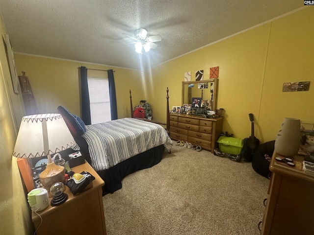 carpeted bedroom with crown molding, ceiling fan, and a textured ceiling