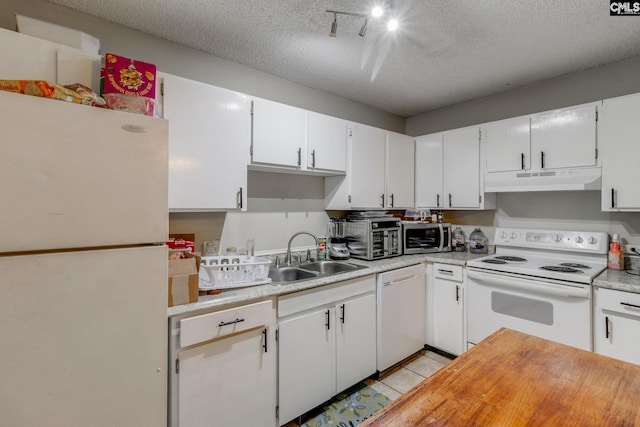 kitchen featuring white cabinetry, sink, white appliances, and a textured ceiling