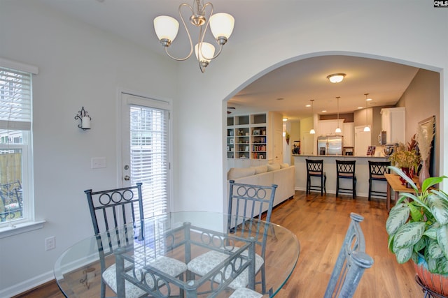 dining room with a chandelier and hardwood / wood-style floors