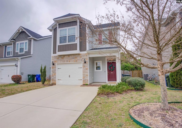 view of front of property with a garage and a front lawn