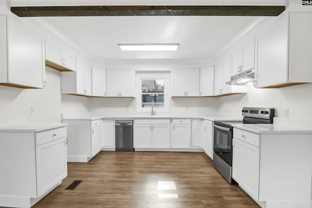 kitchen featuring dark wood-type flooring, sink, white cabinetry, a textured ceiling, and appliances with stainless steel finishes