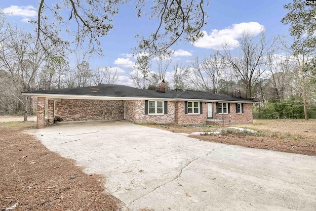 ranch-style house with a carport