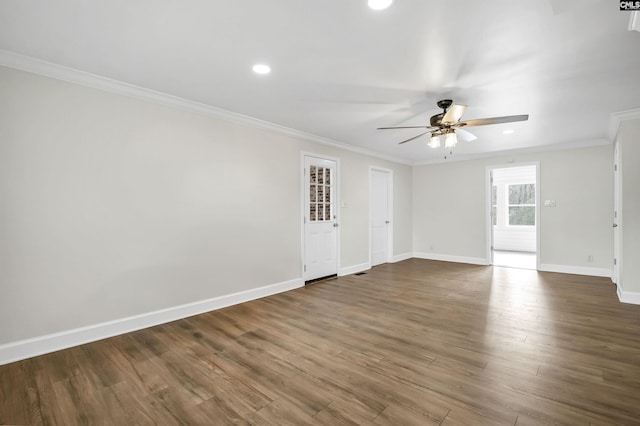 unfurnished room featuring crown molding, ceiling fan, and dark wood-type flooring