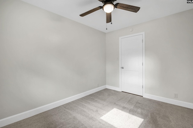 unfurnished bedroom featuring ceiling fan and carpet flooring