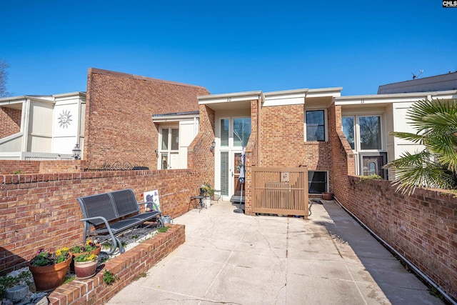 back of house with a patio area