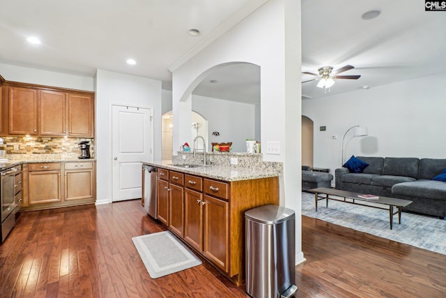576 Flat Creek Dr, Blythewood, SC 29016 - kitchen featuring light stone countertops, dark wood finished floors, a sink, appliances with stainless steel finishes, and open floor plan
