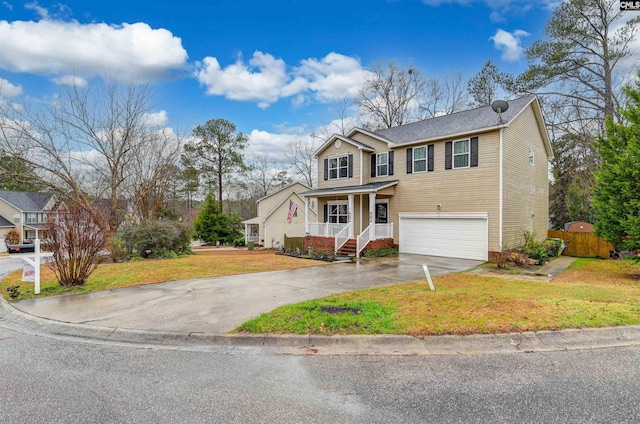 view of front of home featuring a garage, a front yard, and a porch