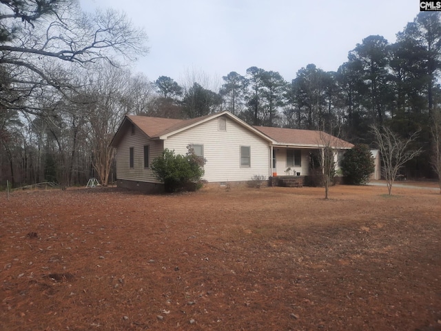 view of property exterior with covered porch