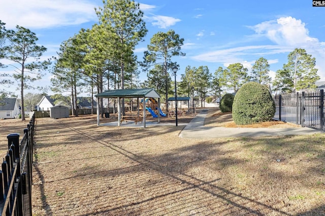 view of jungle gym featuring a shed