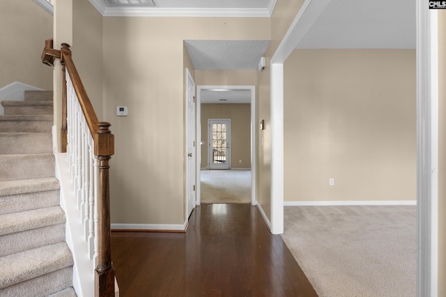 entrance foyer featuring ornamental molding and dark hardwood / wood-style floors