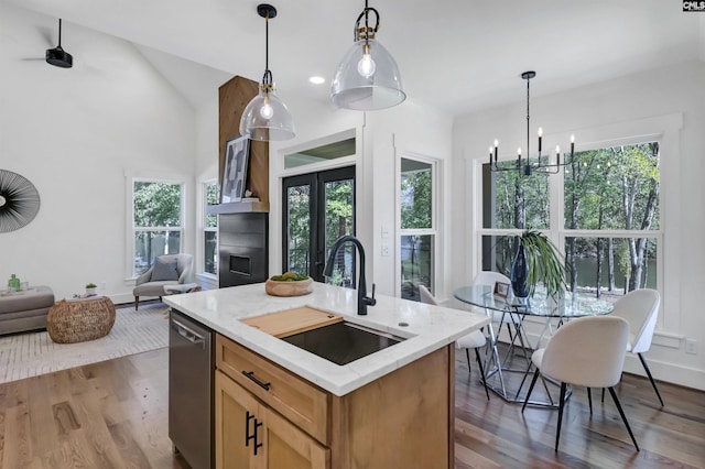 387 Bedford Way, Prosperity, SC 29127 - kitchen with sink, hanging light fixtures, dishwasher, hardwood / wood-style floors, and a kitchen island with sink