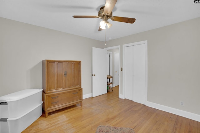 unfurnished room featuring light hardwood / wood-style flooring and ceiling fan