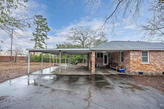 view of vehicle parking featuring a carport