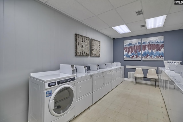 clothes washing area featuring washing machine and dryer