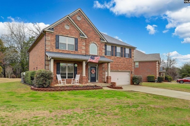 view of front facade with a garage, a front yard, and a porch