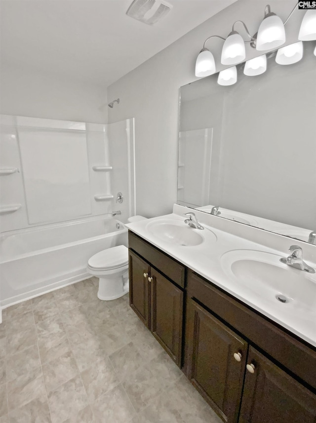 full bathroom with vanity, tub / shower combination, and toilet