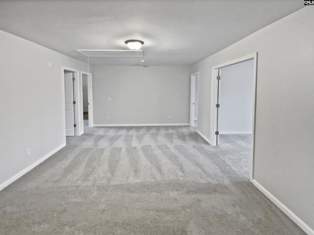 empty room featuring light carpet