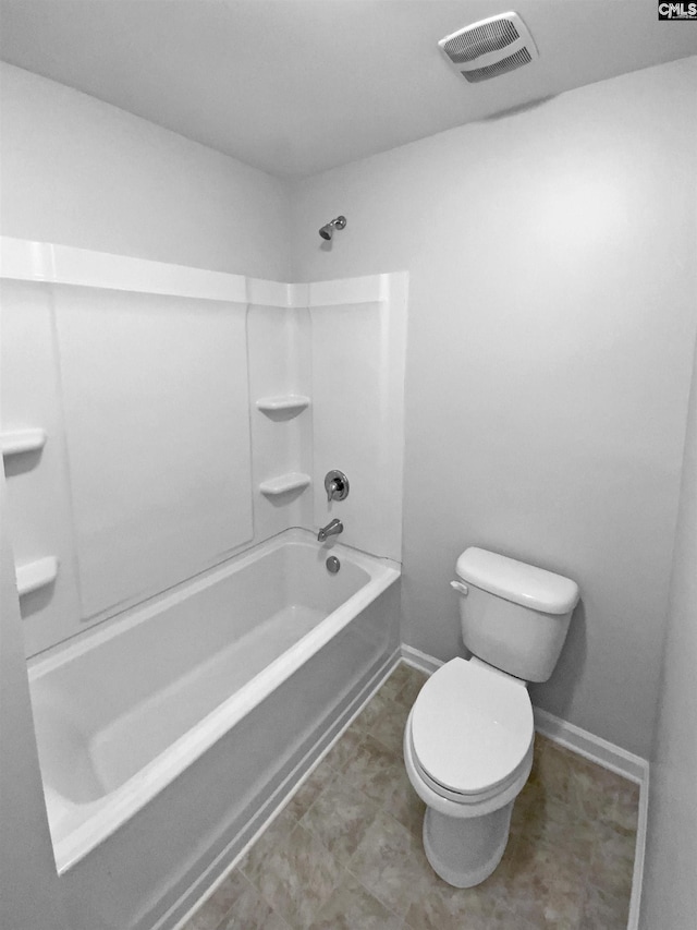 bathroom featuring toilet and bathtub / shower combination