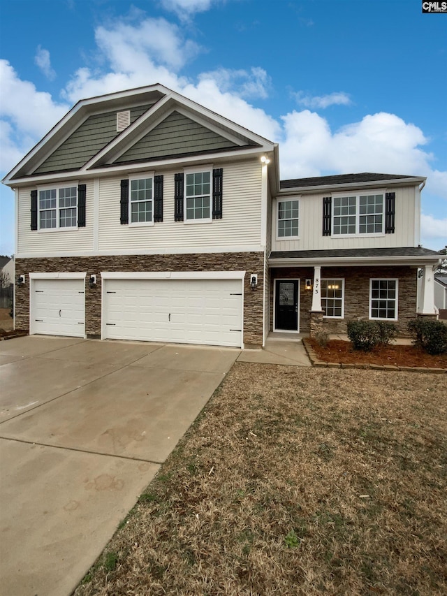 view of front facade featuring a garage and a front lawn