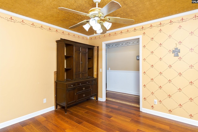 interior space with crown molding, ceiling fan, and dark hardwood / wood-style flooring