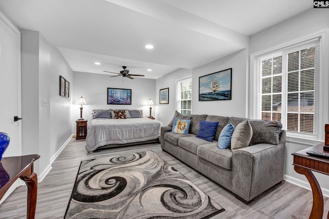 bedroom with light hardwood / wood-style flooring and ceiling fan