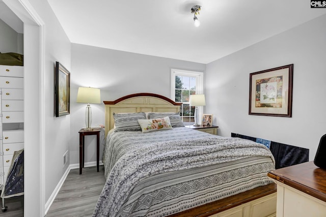 bedroom with light wood-type flooring