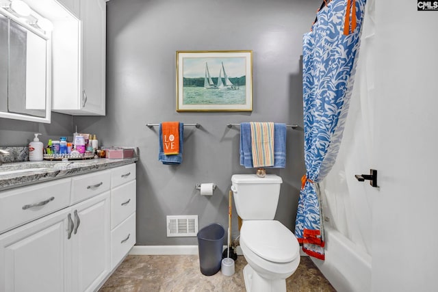 full bathroom with vanity, toilet, and shower / tub combo with curtain