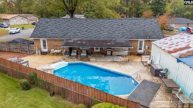 view of swimming pool featuring a patio