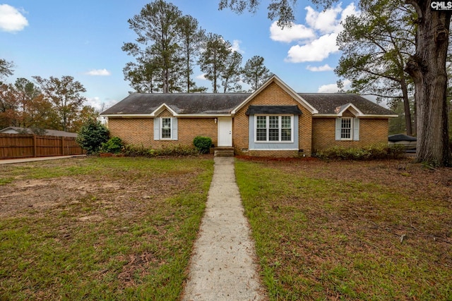 single story home featuring a front yard