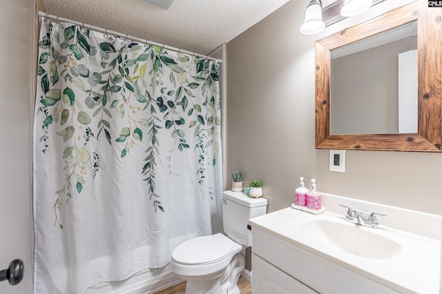 full bathroom featuring vanity, toilet, a textured ceiling, and shower / bathtub combination with curtain