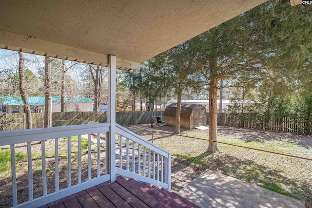 deck featuring a shed