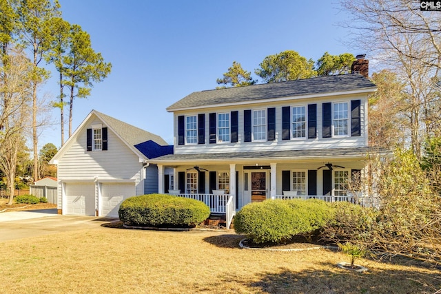 colonial-style house with a porch and a garage