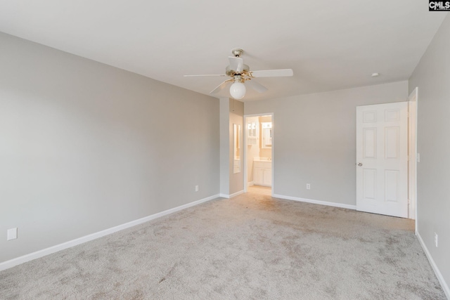 unfurnished room with ceiling fan and light colored carpet