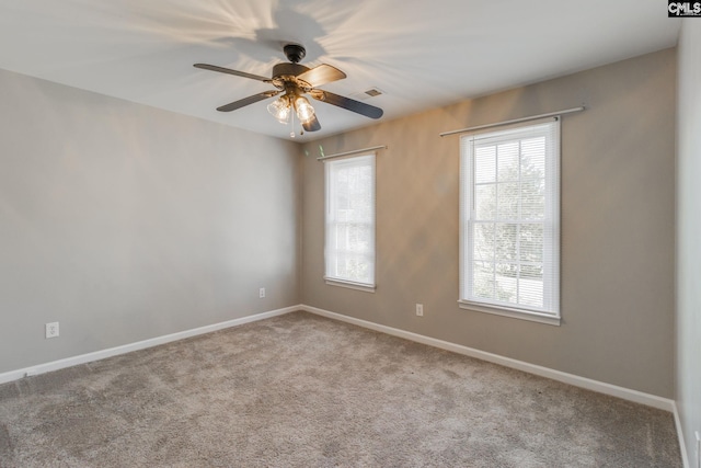 unfurnished room with light carpet and ceiling fan