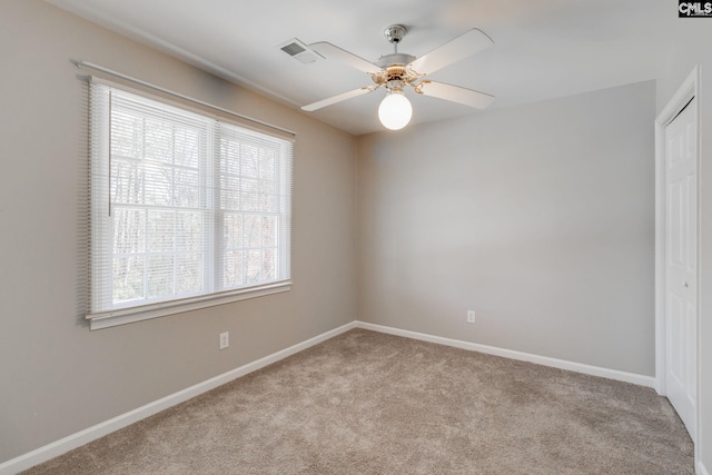 unfurnished room with light carpet and ceiling fan