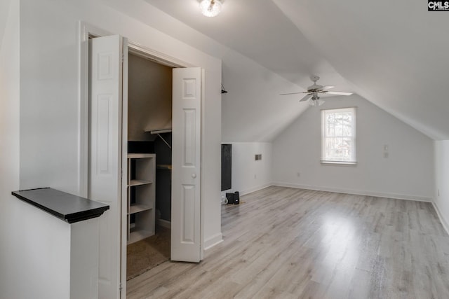 additional living space with vaulted ceiling, ceiling fan, and light hardwood / wood-style flooring