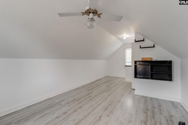 bonus room with vaulted ceiling, ceiling fan, and light hardwood / wood-style flooring