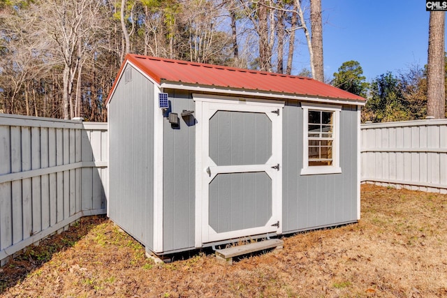 view of outbuilding with a yard