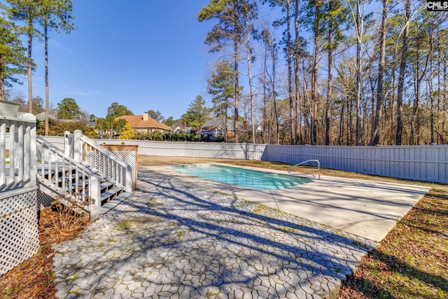 view of swimming pool with a patio area